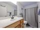 Clean bathroom with single sink vanity and shower/tub combo at 8749 E Willetta St, Scottsdale, AZ 85257