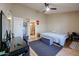 Bright bedroom with a large bed, ensuite bathroom access, and plenty of natural light at 8749 E Willetta St, Scottsdale, AZ 85257
