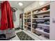 Large walk-in closet with ample shelving and hanging space at 8749 E Willetta St, Scottsdale, AZ 85257