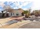 House with brick paver driveway and palm trees at 8749 E Willetta St, Scottsdale, AZ 85257