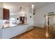 Kitchen with breakfast bar and arched window at 8749 E Willetta St, Scottsdale, AZ 85257