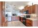 Kitchen features stainless steel refrigerator and wood cabinetry at 8749 E Willetta St, Scottsdale, AZ 85257