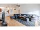 Living area features L-shaped sectional sofa and wood floors at 8749 E Willetta St, Scottsdale, AZ 85257