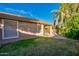 Spacious backyard with grassy area and a view of the home's exterior at 8903 N 57Th Dr, Glendale, AZ 85302