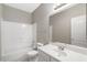 Clean bathroom with white vanity and bathtub shower combo at 8903 N 57Th Dr, Glendale, AZ 85302