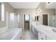 Bathroom with double vanity and large walk-in shower at 8903 N 57Th Dr, Glendale, AZ 85302