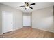 Bedroom with wood flooring and double door closet at 8903 N 57Th Dr, Glendale, AZ 85302