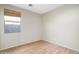 Spacious bedroom with hardwood floors and large window at 8903 N 57Th Dr, Glendale, AZ 85302