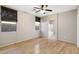 Main bedroom with wood floors and en-suite bathroom access at 8903 N 57Th Dr, Glendale, AZ 85302