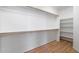 Large walk-in closet with shelves and hanging rods at 8903 N 57Th Dr, Glendale, AZ 85302