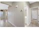 Bright entry hall with tile flooring and access to powder room at 8903 N 57Th Dr, Glendale, AZ 85302