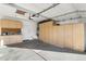 Garage with built-in storage cabinets and ample space at 8903 N 57Th Dr, Glendale, AZ 85302