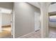 Bright hallway with tile floors and access to bedrooms at 8903 N 57Th Dr, Glendale, AZ 85302