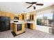 Open kitchen with island and view to backyard at 8903 N 57Th Dr, Glendale, AZ 85302