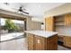 Kitchen island with white countertop and view to backyard at 8903 N 57Th Dr, Glendale, AZ 85302