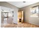 Home office featuring wood flooring and built-in shelving at 8903 N 57Th Dr, Glendale, AZ 85302