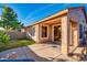Covered patio with grassy backyard and seating area at 8903 N 57Th Dr, Glendale, AZ 85302