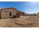 Landscaped backyard with patio and rock border at 1102 N 5Th St, Buckeye, AZ 85326