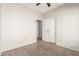 Simple bedroom with double door closet and carpeting at 1102 N 5Th St, Buckeye, AZ 85326