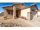 Front view of the house, showing the entrance and landscaping at 1102 N 5Th St, Buckeye, AZ 85326