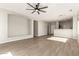 Open living area with wood-look flooring and kitchen bar at 1102 N 5Th St, Buckeye, AZ 85326