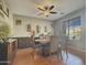 Bright dining room with wood table and wine storage at 14335 W Country Gables Dr, Surprise, AZ 85379