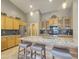 Kitchen boasts granite countertops, wood cabinets, and stainless steel appliances at 14335 W Country Gables Dr, Surprise, AZ 85379