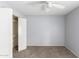Simple bedroom with ceiling fan and carpeting at 1449 W Mohawk Ln, Phoenix, AZ 85027