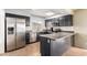 Well-equipped kitchen with dark cabinetry and stainless steel appliances at 1449 W Mohawk Ln, Phoenix, AZ 85027