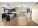 Kitchen boasts dark cabinetry, stainless steel appliances, and an eat-in area at 1449 W Mohawk Ln, Phoenix, AZ 85027