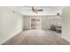 Spacious living room featuring neutral carpeting and access to a patio at 1449 W Mohawk Ln, Phoenix, AZ 85027
