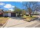 Attached garage with long driveway and mature trees at 1545 W Berridge Ln, Phoenix, AZ 85015