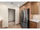 Kitchen features stainless steel appliances and pantry at 1574 E Kent Ave, Chandler, AZ 85225