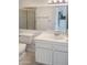 Bathroom with single sink vanity, toilet, and tiled floor at 16635 N Cave Creek Rd # 228, Phoenix, AZ 85032
