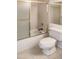 Bathroom with shower/tub combo, toilet, and tiled floors at 16635 N Cave Creek Rd # 228, Phoenix, AZ 85032