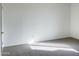 Simple carpeted bedroom with neutral walls and sunlight at 16635 N Cave Creek Rd # 228, Phoenix, AZ 85032