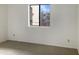 Simple bedroom with carpeted floor and window with view at 16635 N Cave Creek Rd # 228, Phoenix, AZ 85032