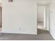 Simple hallway with carpeted floor and doorway to another room at 16635 N Cave Creek Rd # 228, Phoenix, AZ 85032