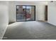 Spacious living area with sliding glass doors leading to a patio at 16635 N Cave Creek Rd # 228, Phoenix, AZ 85032