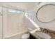 Bathroom with tub shower, granite vanity, and mirror at 17606 N 17Th Pl # 1021, Phoenix, AZ 85022