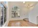 Living room with laminate flooring and an arched window at 17606 N 17Th Pl # 1021, Phoenix, AZ 85022