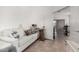 Small den with gray couch and access to living area at 18208 W Skyline Dr, Surprise, AZ 85374
