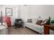 Small den with gray couch and red dresser at 18208 W Skyline Dr, Surprise, AZ 85374