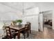 Dining area with wood table and chairs, and view into bedroom at 18208 W Skyline Dr, Surprise, AZ 85374