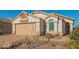 One-story house with landscaped yard and two-car garage at 18208 W Skyline Dr, Surprise, AZ 85374