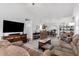 Open living room with a view into the kitchen and dining area at 18208 W Skyline Dr, Surprise, AZ 85374