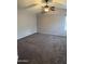 Primary bedroom with wall-to-wall carpet and ceiling fan at 18818 N 39Th St, Phoenix, AZ 85050