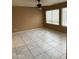 Living room with tile flooring and ceiling fan at 18818 N 39Th St, Phoenix, AZ 85050