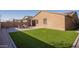 Artificial turf backyard with patio and seating area at 2033 W Burnside Trl, Phoenix, AZ 85085