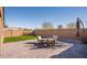 Artificial turf backyard with a patio and seating area at 2033 W Burnside Trl, Phoenix, AZ 85085